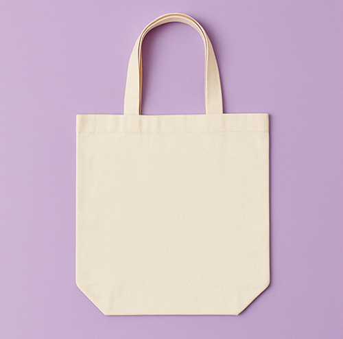 Beige tote bag on a purple background